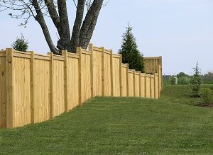 How to Build a Horizontal Plank Fence in a Hillside Backyard